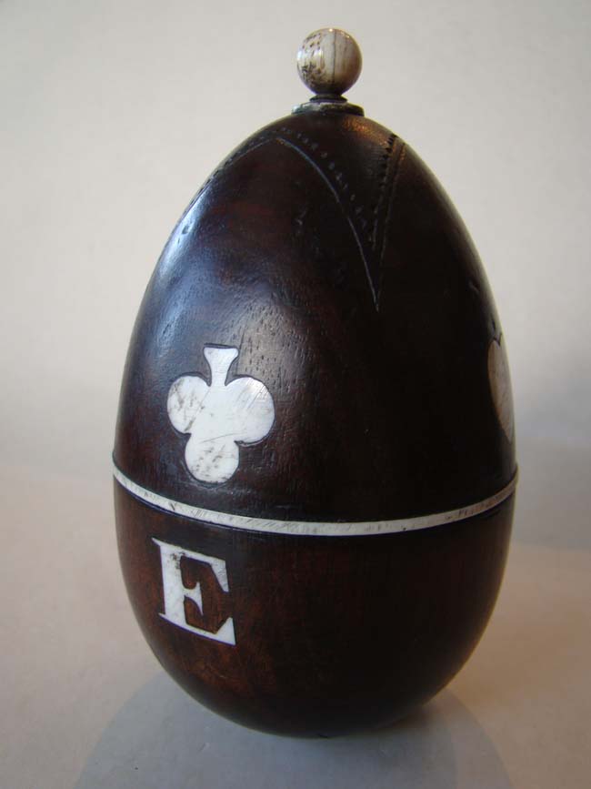 A 19th century sailor-made bone inlaid wooden games egg dated 1854